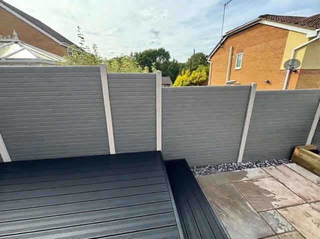 Composite fencing and decking beside patio