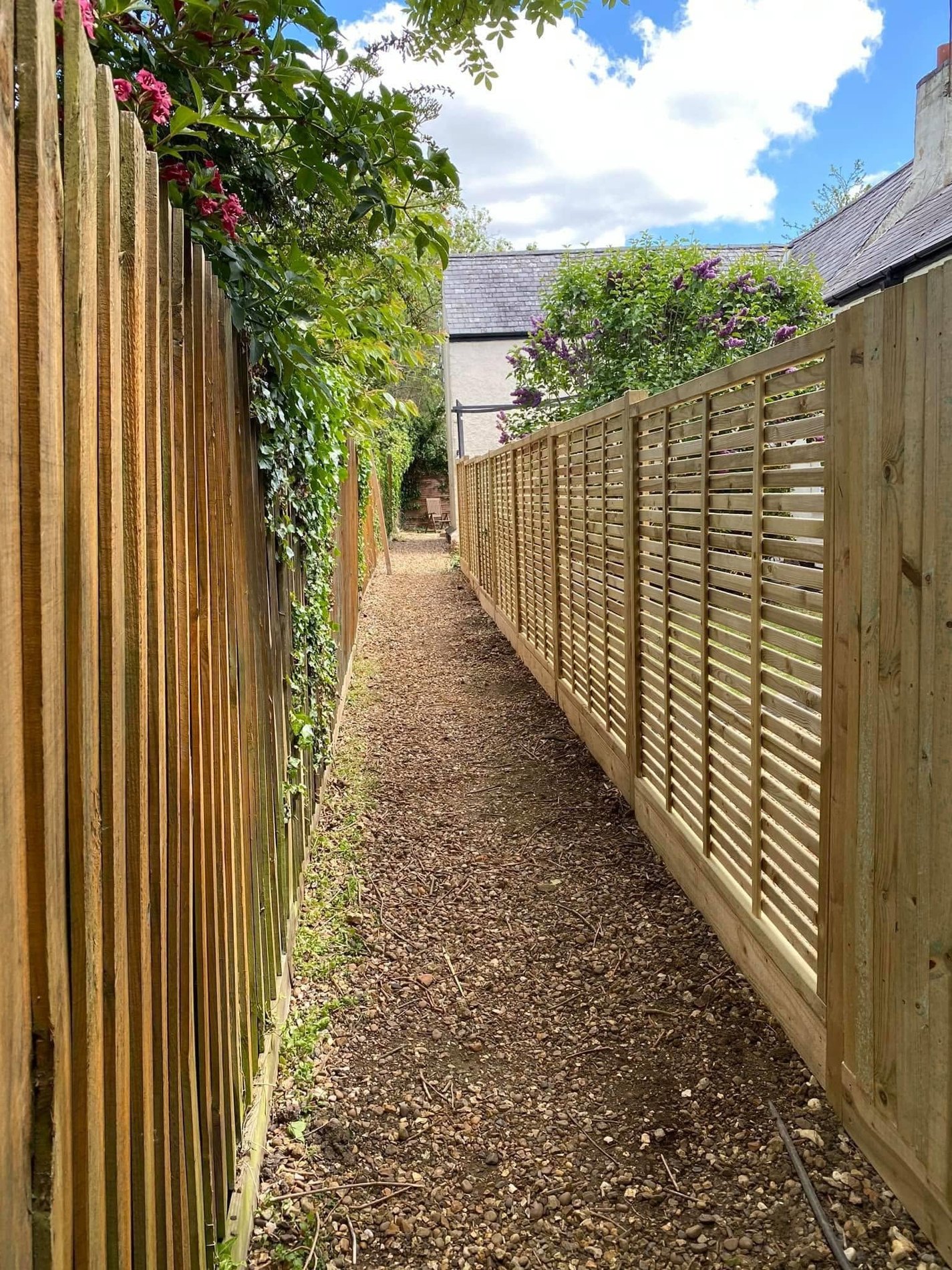 Slatted timber fence along a path